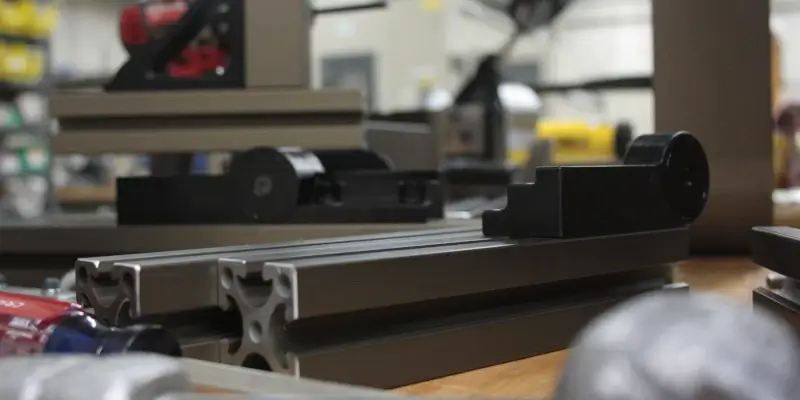 Aluminum component assembled with a stainless steel clamp and fastener.