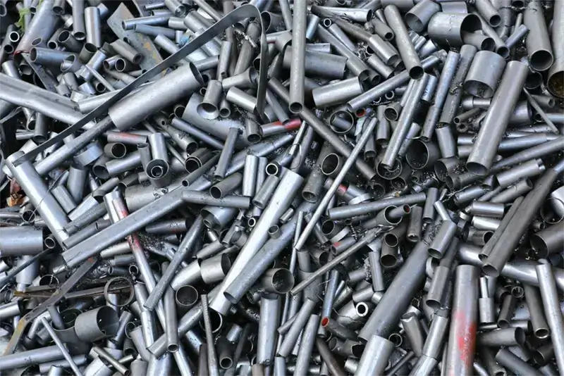 Clean aluminum pieces compared with attached, contaminated, and mixed aluminum scrap